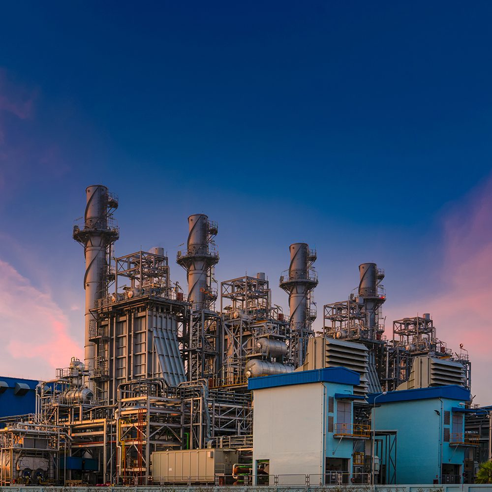 Power plant for Industrial Estate at twilight, Natural gas combined cycle, power plant and Turbine generator . Energy power plant of industrial refinery oil and gas at twilight to supply electricity